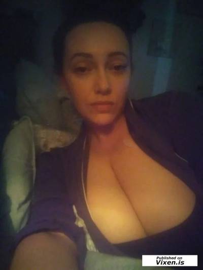 Mature Dark Haired Beauty with Dangerous Curves in Chicago IL